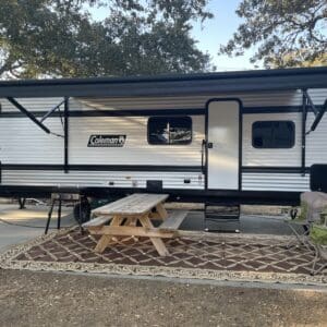 Coleman camper van campsite setup.