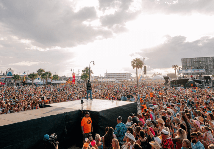 A crowd of people standing on top of a stage.