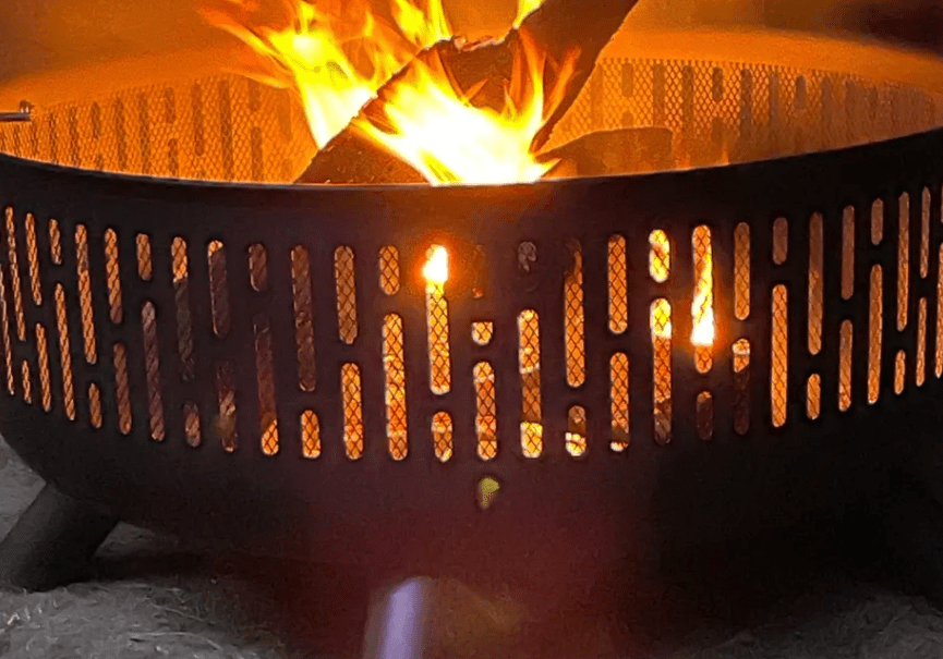 A fire pit with flames coming out of it.