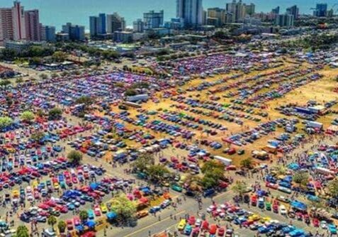 Massive car show near the beach.